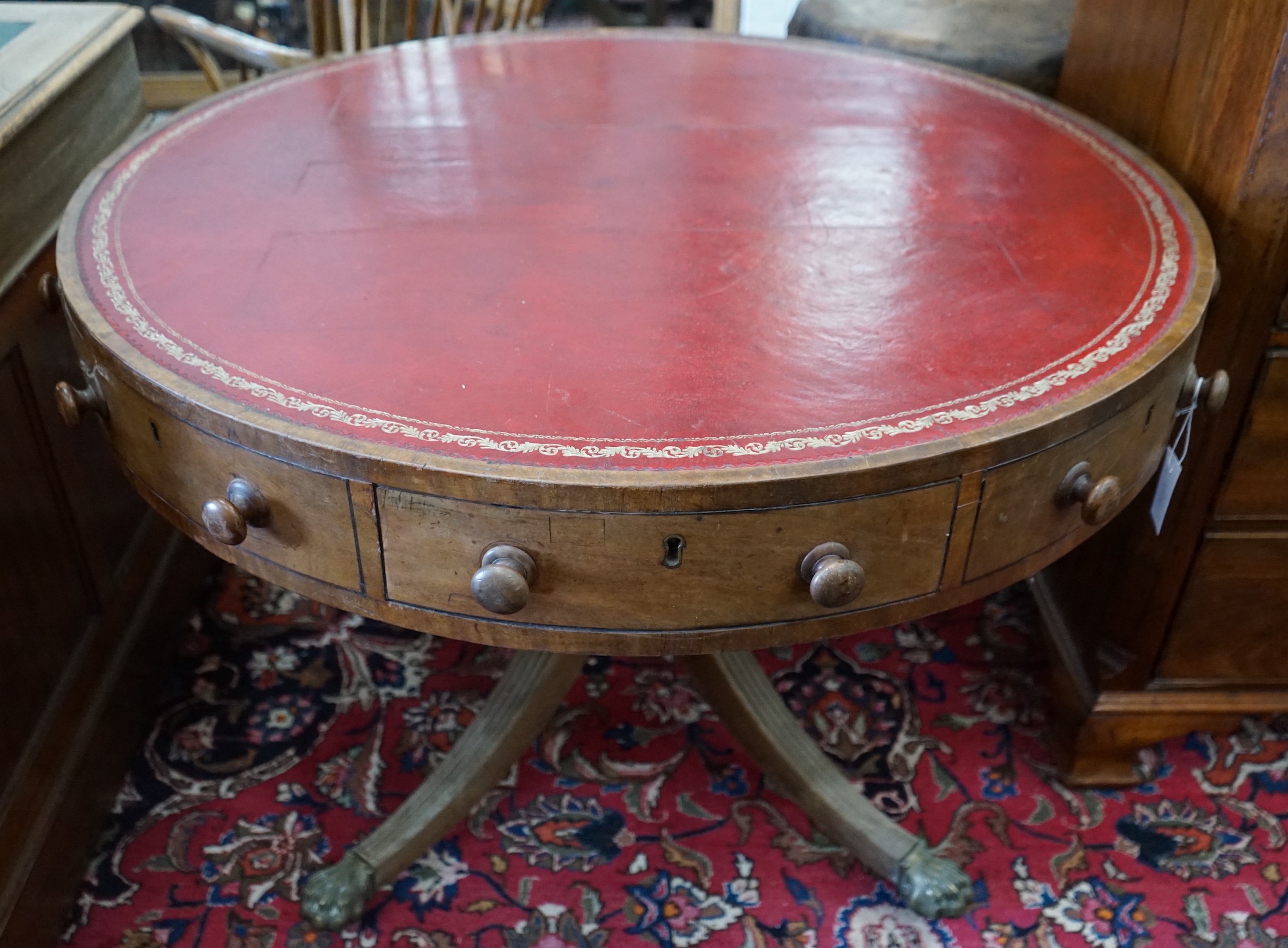 A 19th century circular drum table, diameter 106cm, height 74cm